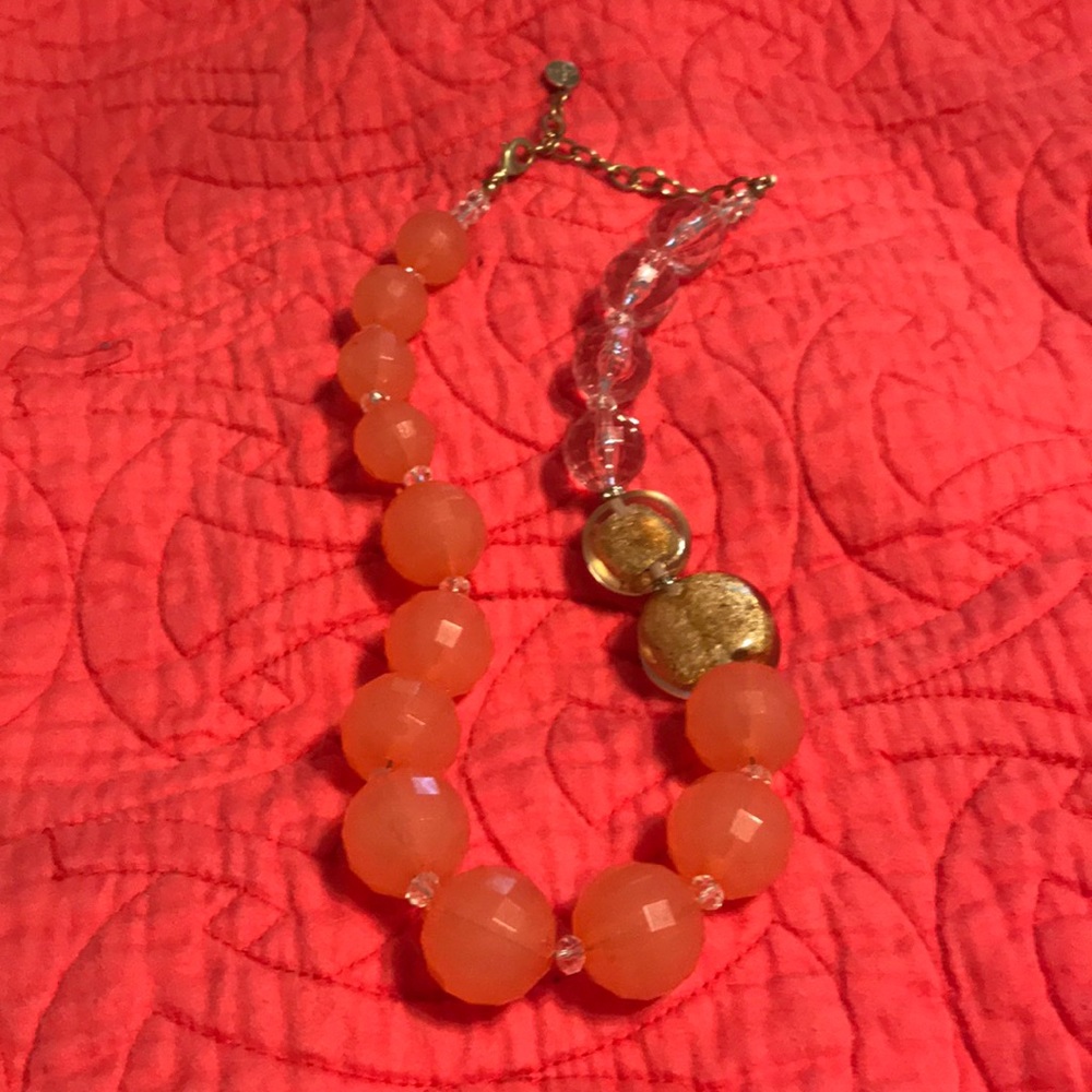 Pink and gold necklace.